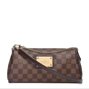 LOUIS VUITTON
Damier Ebene Eva Clutch
9.75 in L x 5.25 in H x 1.75 in W